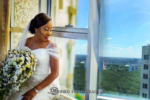 Nigerian Bride Looking Out The Window Grace and Pirzing LoveweddingsNG Diko Photography