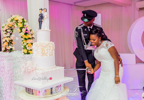 nigerian-police-wedding-ify-and-chisom-cutting-the-cake-the-event-girl-ng-loveweddingsng