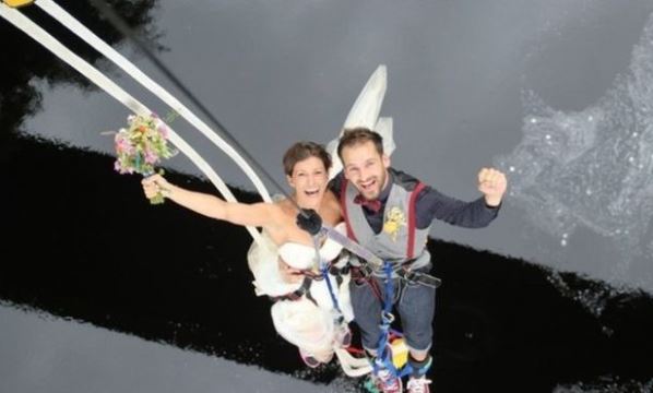Daredevil newlyweds plunge into married life by jumping 130ft