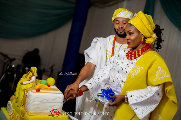 Nigerian Traditional Wedding - Bunmi and Mayowa couple cutting the cake LoveweddingsNG 1