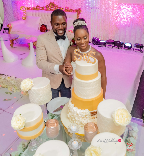 Nigerian Wedding in London Seun and Segun Bride and Groom Cutting Wedding Cake LoveweddingsNG Dazzitto Photography