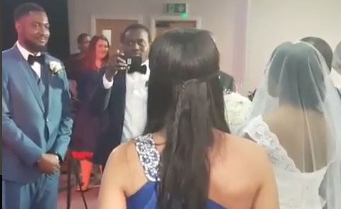 Bride sings her own song as she walks down the aisle to meet her groom